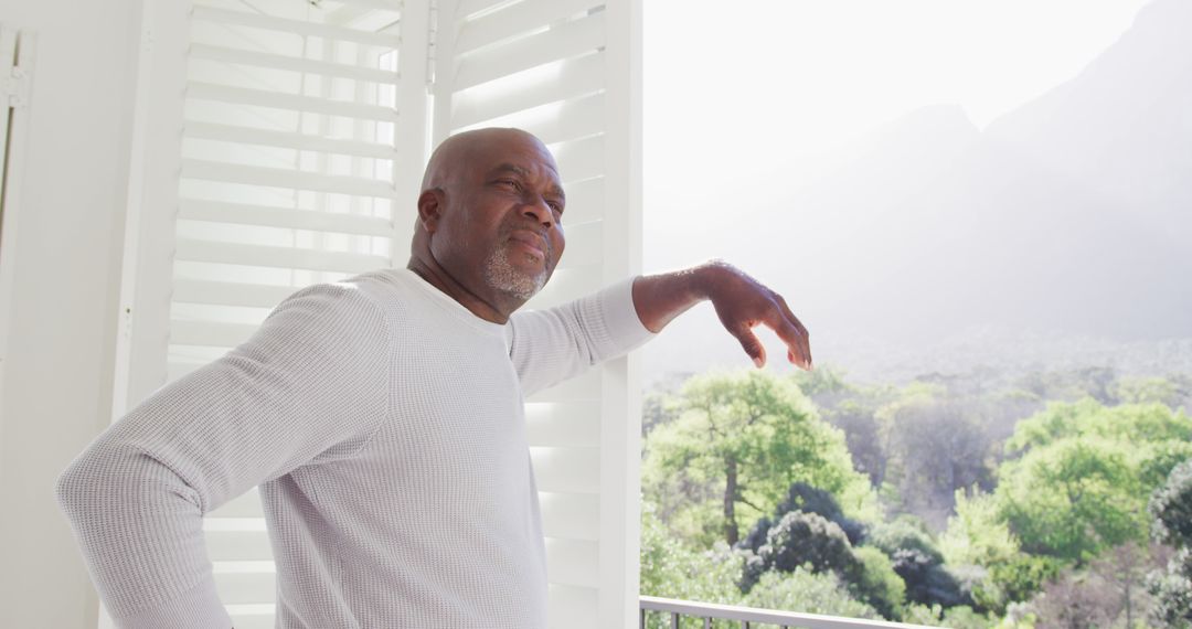 Senior African American Man Enjoying Nature from Balcony - Free Images, Stock Photos and Pictures on Pikwizard.com