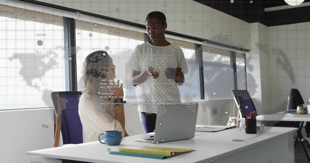 Colleagues Collaborating in Modern Office with Digital Map Overlay