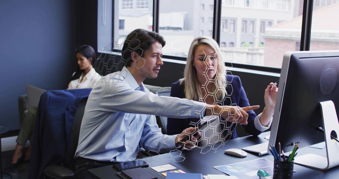 Colleagues Collaborating on Modern Computer in Professional Office