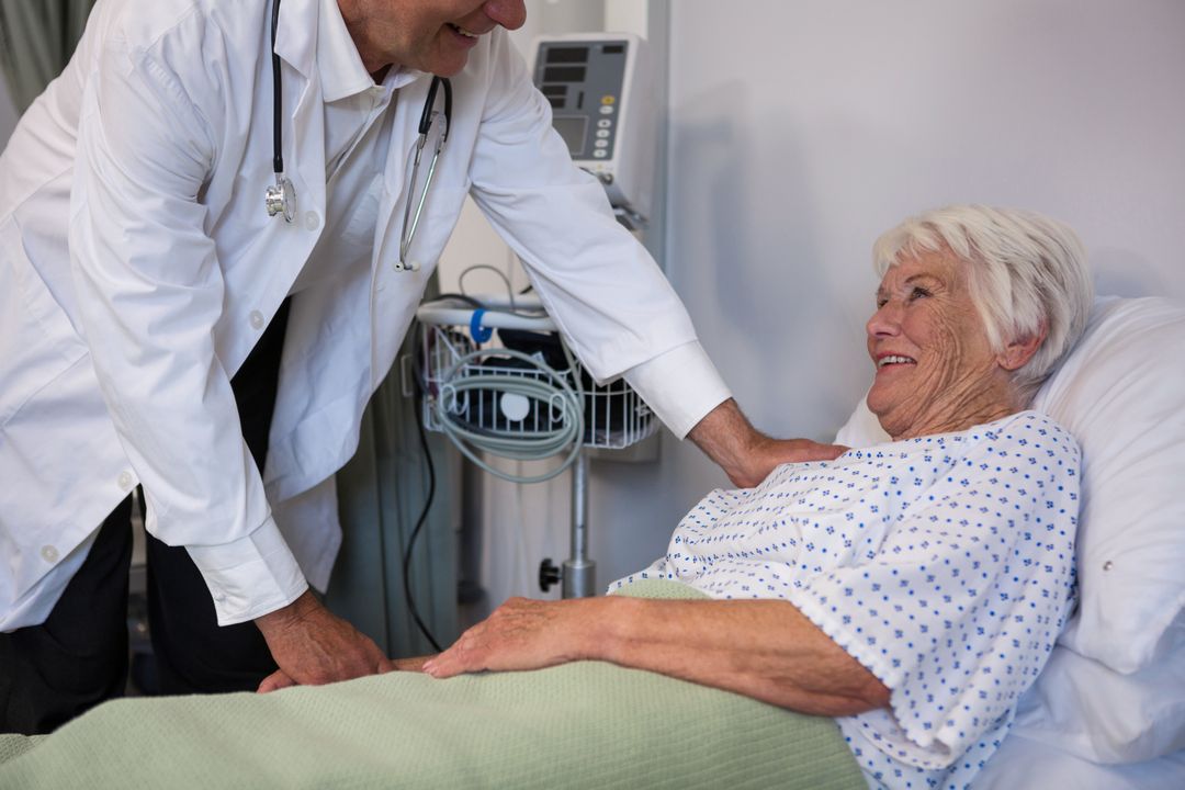 Doctor examining senior patient in ward - Free Images, Stock Photos and Pictures on Pikwizard.com