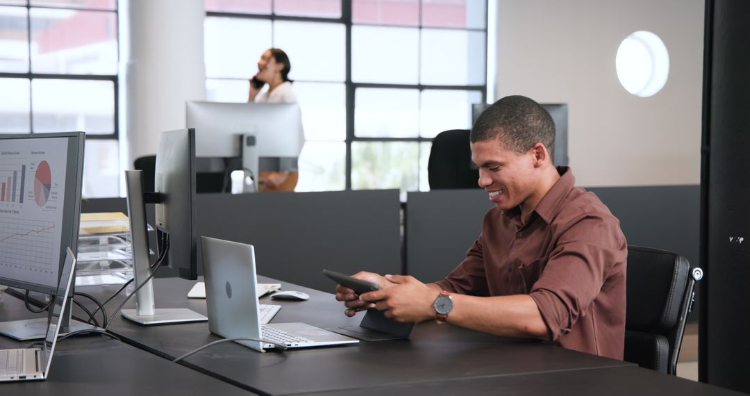 Smiling Professional with Tablet in Modern Office Environment