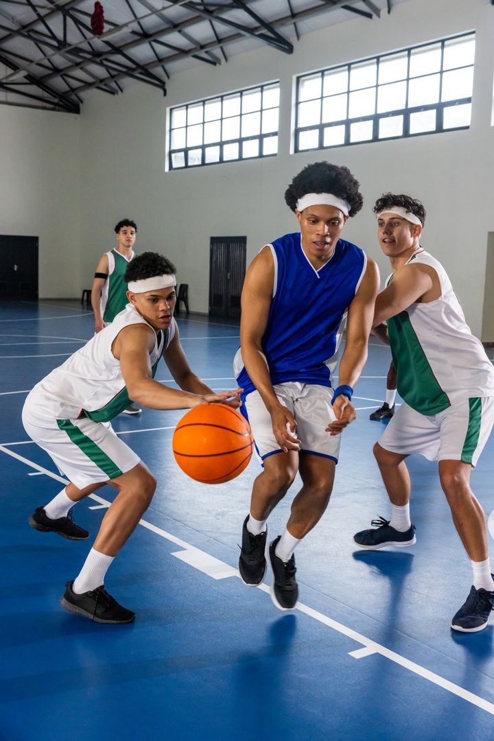 Intense Basketball Game Action in Indoor Gym Setting