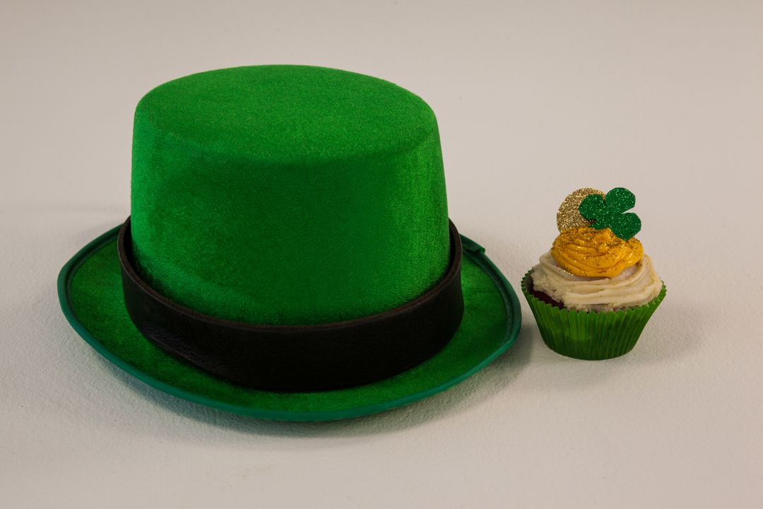St Patricks Day leprechaun hat with shamrock on cupcake - Free Images, Stock Photos and Pictures on Pikwizard.com