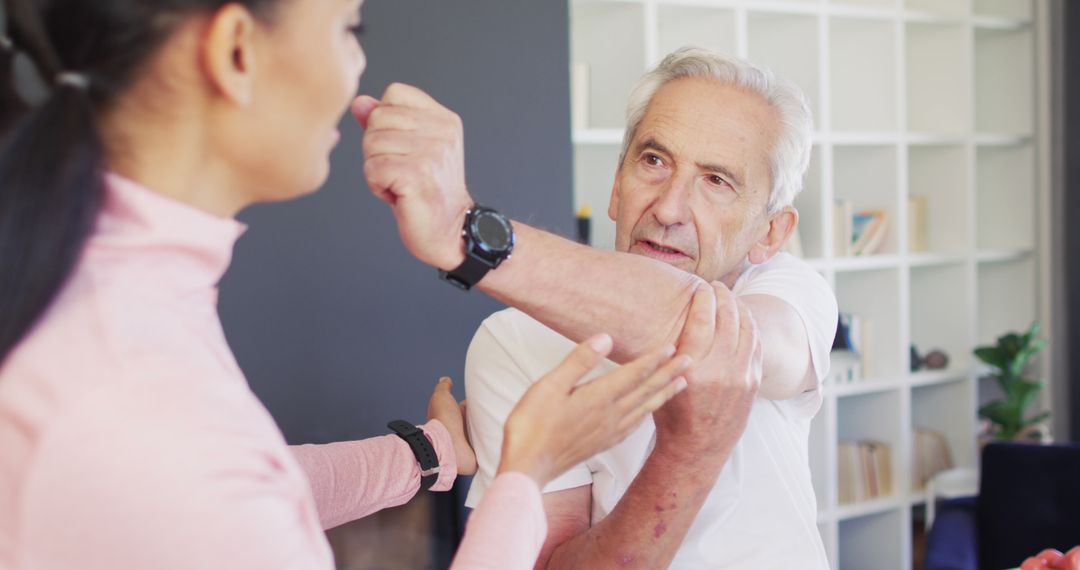 Senior Man Receiving Physical Therapy for Arm Pain - Free Images, Stock Photos and Pictures on Pikwizard.com