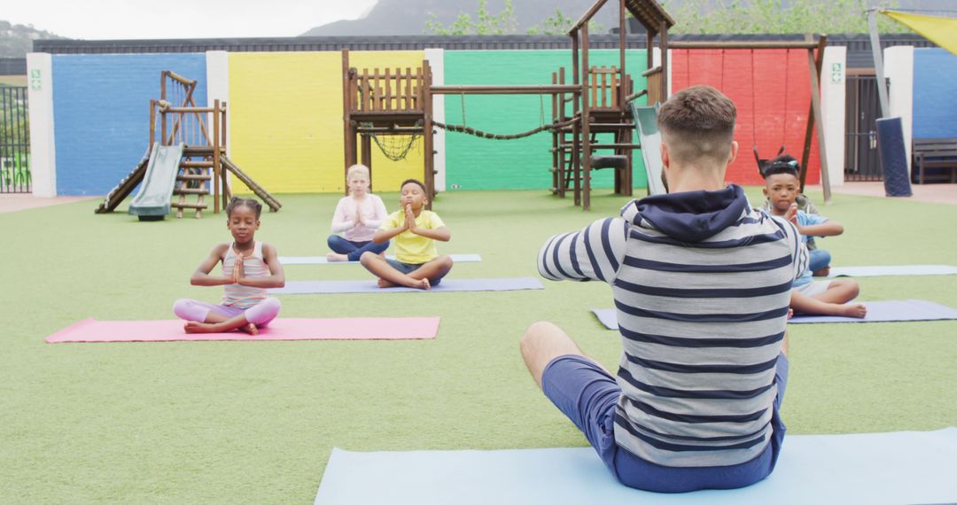 Children Practicing Yoga with Instructor in Playground - Free Images, Stock Photos and Pictures on Pikwizard.com