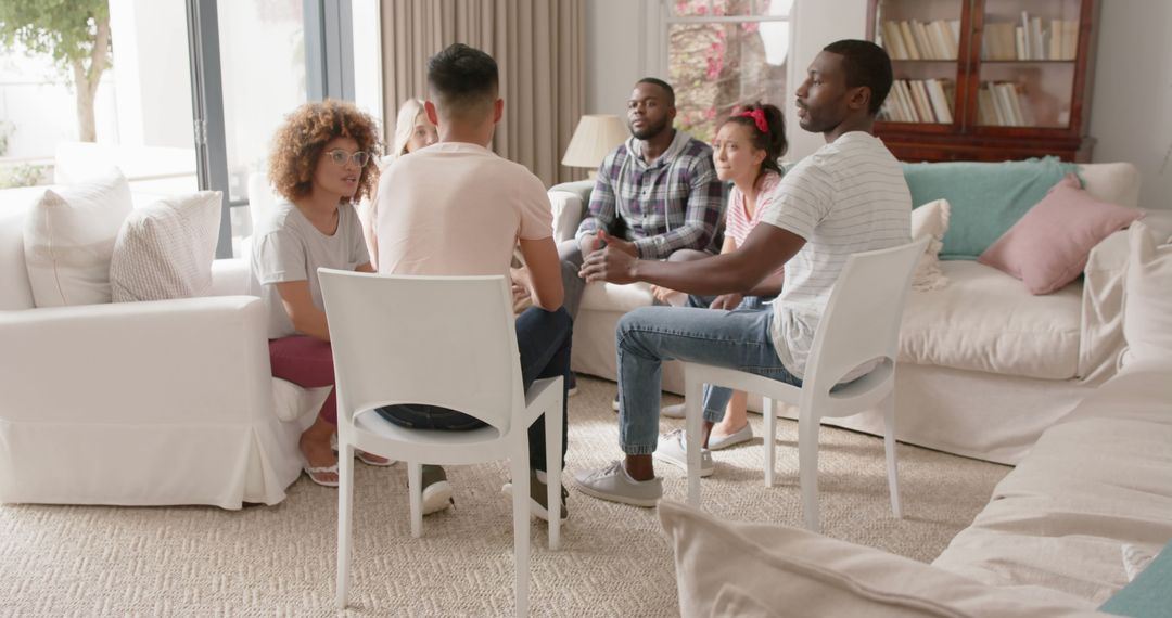 Diverse group having casual discussion in cozy living room - Free Images, Stock Photos and Pictures on Pikwizard.com