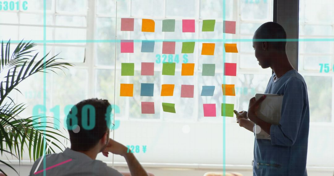 Diverse Business Team Analyzing Planning Board with Financial Data Overlay