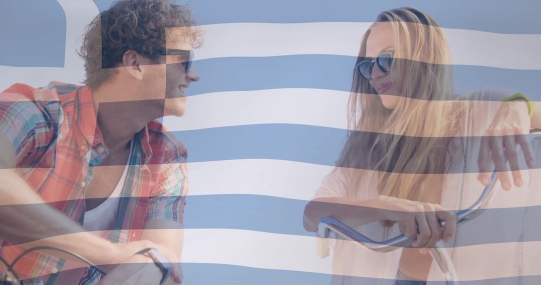 Smiling Couple Cycling with Greek Flag Overlay Showing Vacation Fun