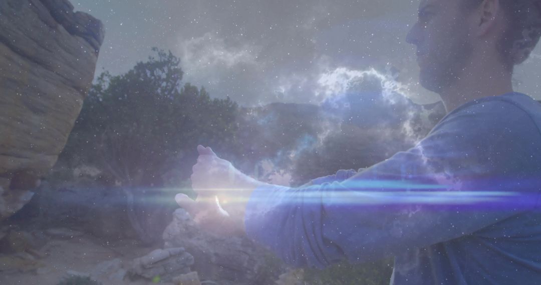 Adventurous Hiker Clasping Hands with Galactic Light in Mystical Canyon