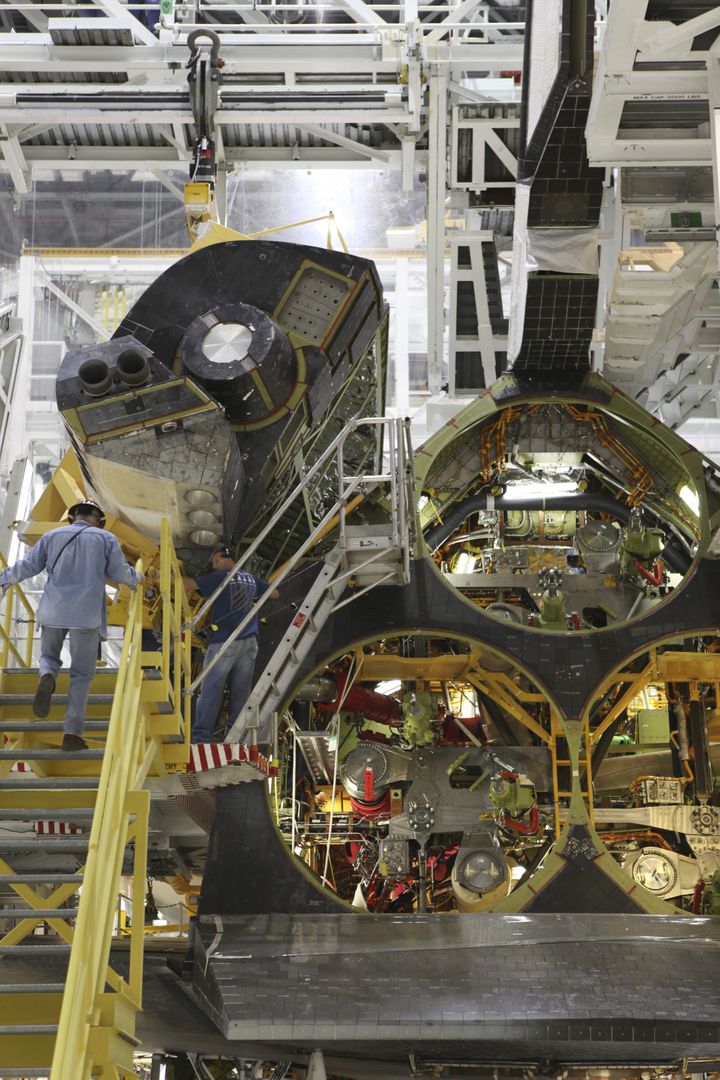 Technicians Installing Space Shuttle Endeavour's OMS Pod in Processing Facility - Free Images, Stock Photos and Pictures on Pikwizard.com