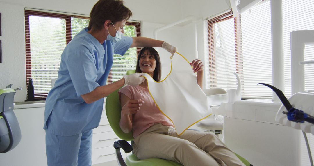 Dentist Preparing Patient for Checkup in Modern Dental Office - Free Images, Stock Photos and Pictures on Pikwizard.com