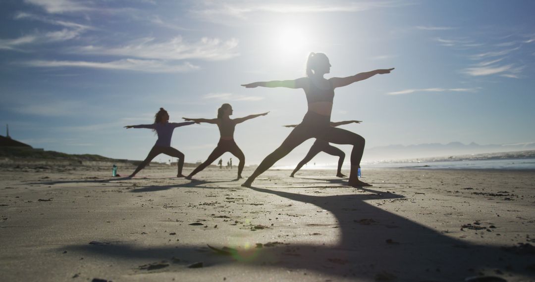 Group of diverse female friends practicing yoga at the beach - Free Images, Stock Photos and Pictures on Pikwizard.com