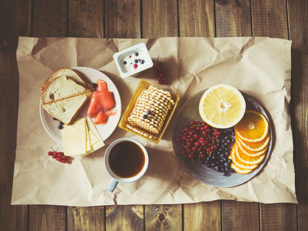 Rustic Breakfast with Bread, Fruits and Coffee on Rustic Table