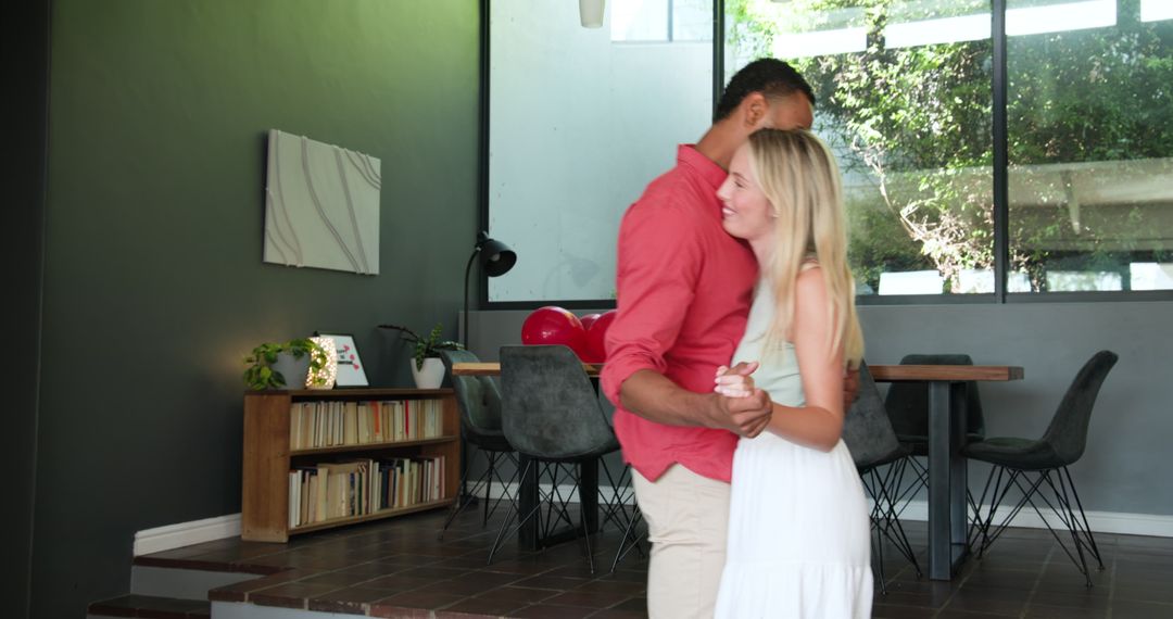 Smiling Interracial Couple Enjoying Dance in Living Room