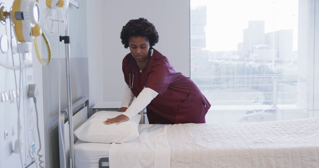 Nurse Changing Bed Linens in Hospital Room - Free Images, Stock Photos and Pictures on Pikwizard.com