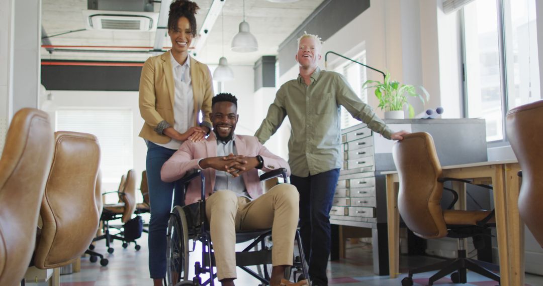 Diverse Business Team Including Disabled Colleague Smiling in Modern Office - Free Images, Stock Photos and Pictures on Pikwizard.com