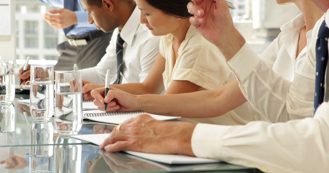 Professional Business Meeting with Note-Taking Professionals