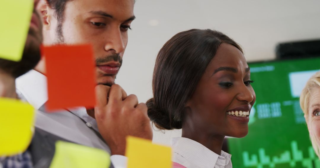 Colleagues Collaborating with Sticky Notes for Creative Brainstorming