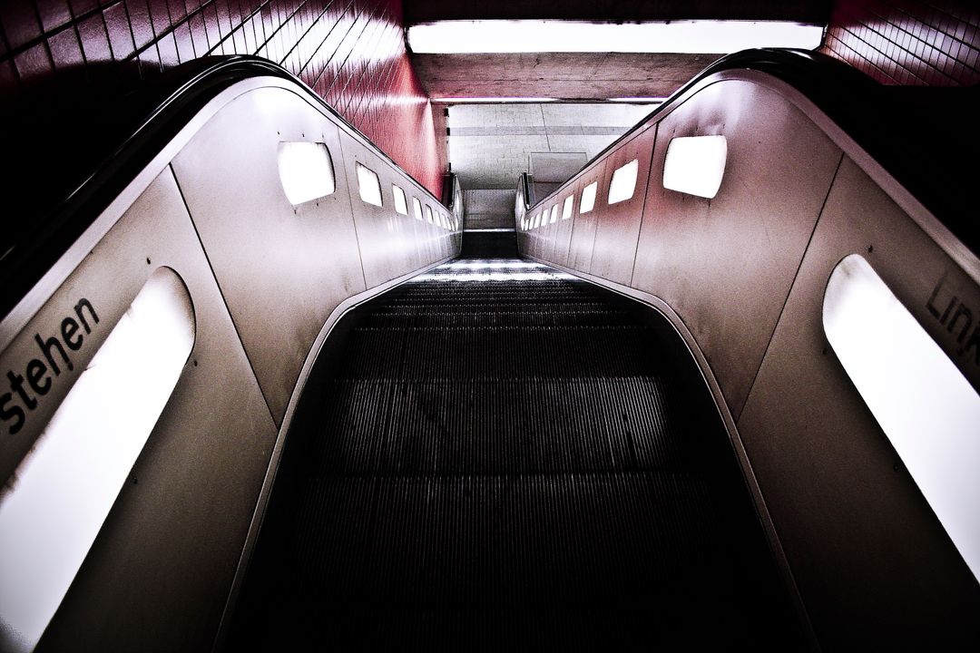 Underground Subway Escalator Leading Downward with Lights - Free Images, Stock Photos and Pictures on Pikwizard.com