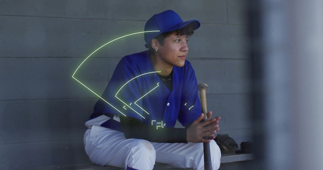 Young Baseball Player Analyzing Field Strategy in Dugout