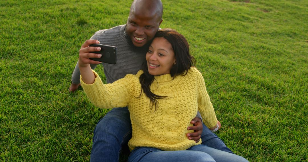 Happy Couple Taking a Selfie During Outdoor Picnic - Free Images, Stock Photos and Pictures on Pikwizard.com