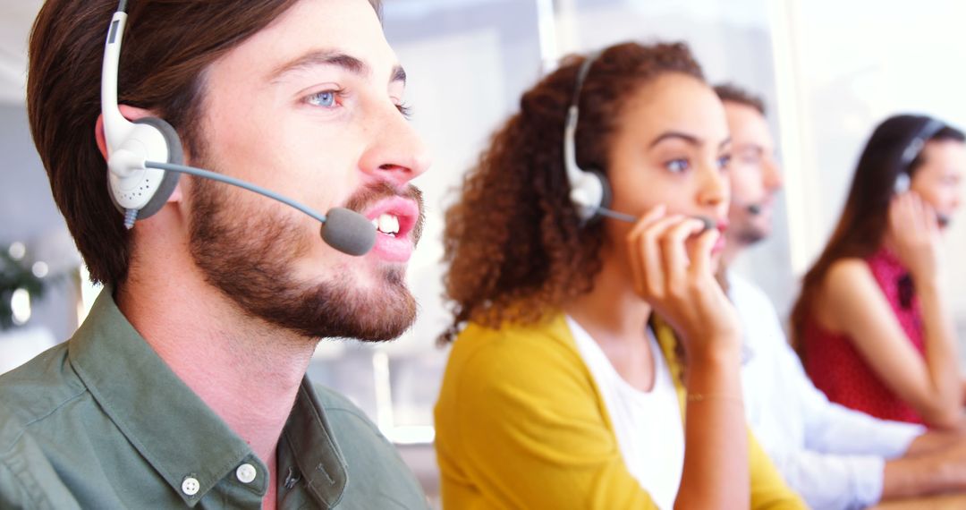 Customer Service Representatives Talking on Headsets in Call Center - Free Images, Stock Photos and Pictures on Pikwizard.com