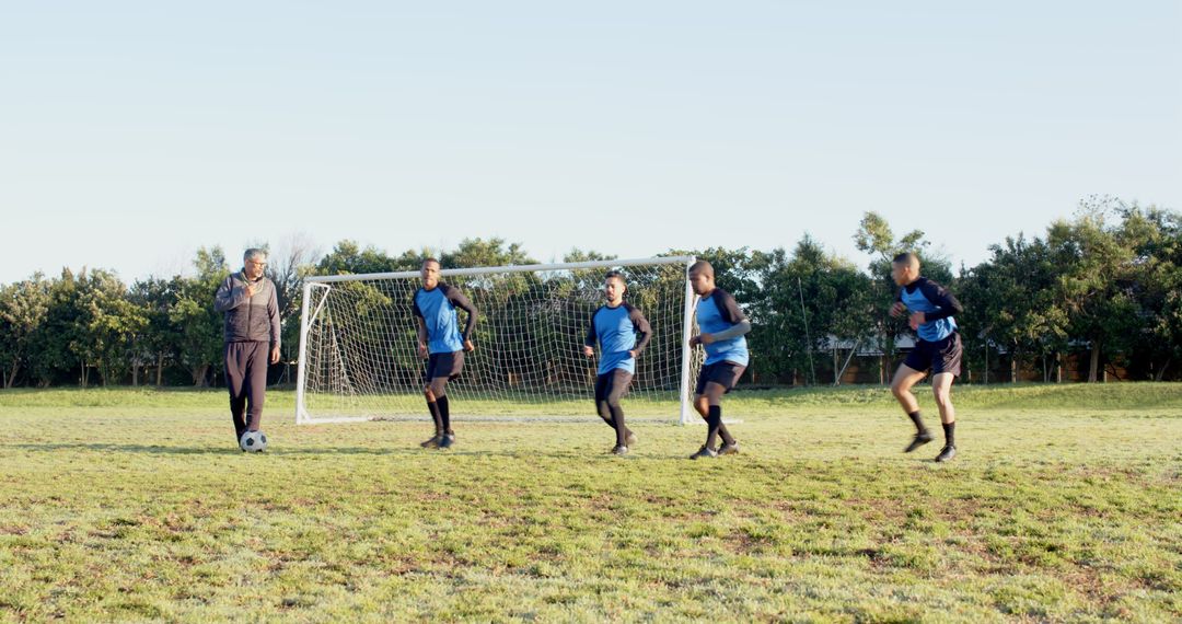 Youth Soccer Team Practicing Drills on Outdoor Field