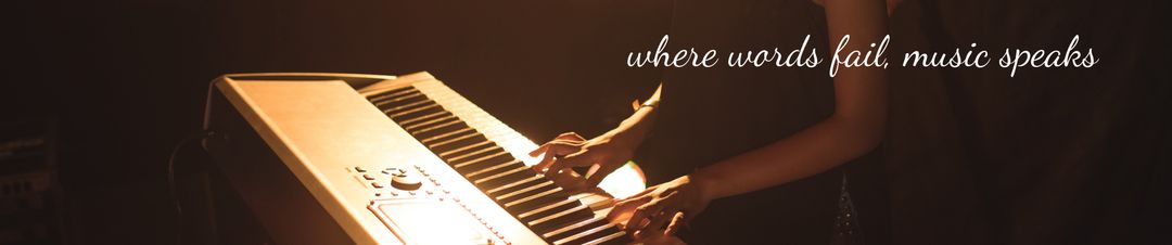 Pianist's hands playing in dimly lit ambiance with inspirational quote