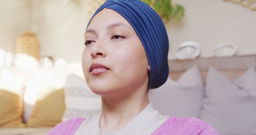 A biracial woman in a hijab balances remote work and relaxation through yoga and cooking at home. - Free Images, Stock Photos and Pictures on Pikwizard.com