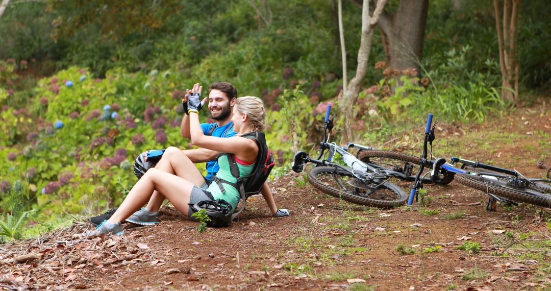 Happy Cyclists Taking a Break in Forest Scenic Area - Free Images, Stock Photos and Pictures on Pikwizard.com