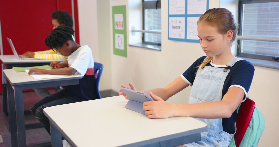 Diverse Students Engaged in Technology and Learning in Classroom