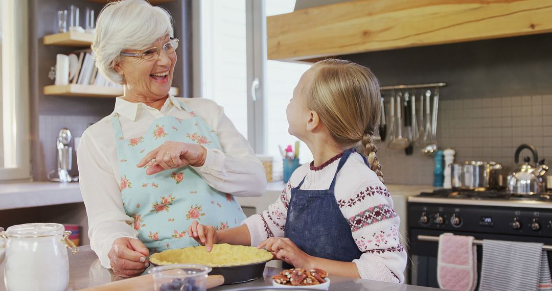 Grandmother and Girl Baking in Modern Kitchen - Free Images, Stock Photos and Pictures on Pikwizard.com