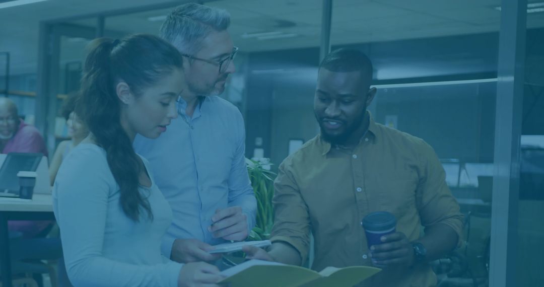 Diverse Team Collaboration in Modern Office with Focus on Teamwork