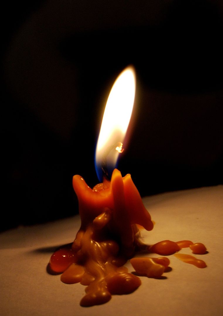 Close-up of Melting Candle with Intense Flame in Darkness - Free Images, Stock Photos and Pictures on Pikwizard.com