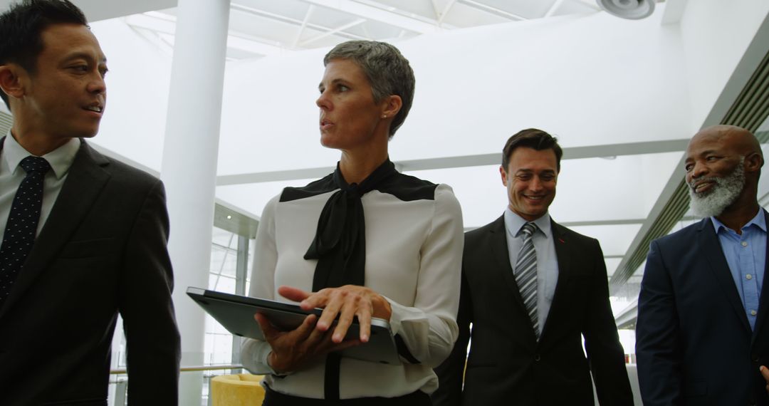 Diverse Professionals Engaged in Team Discussion with Copy Space