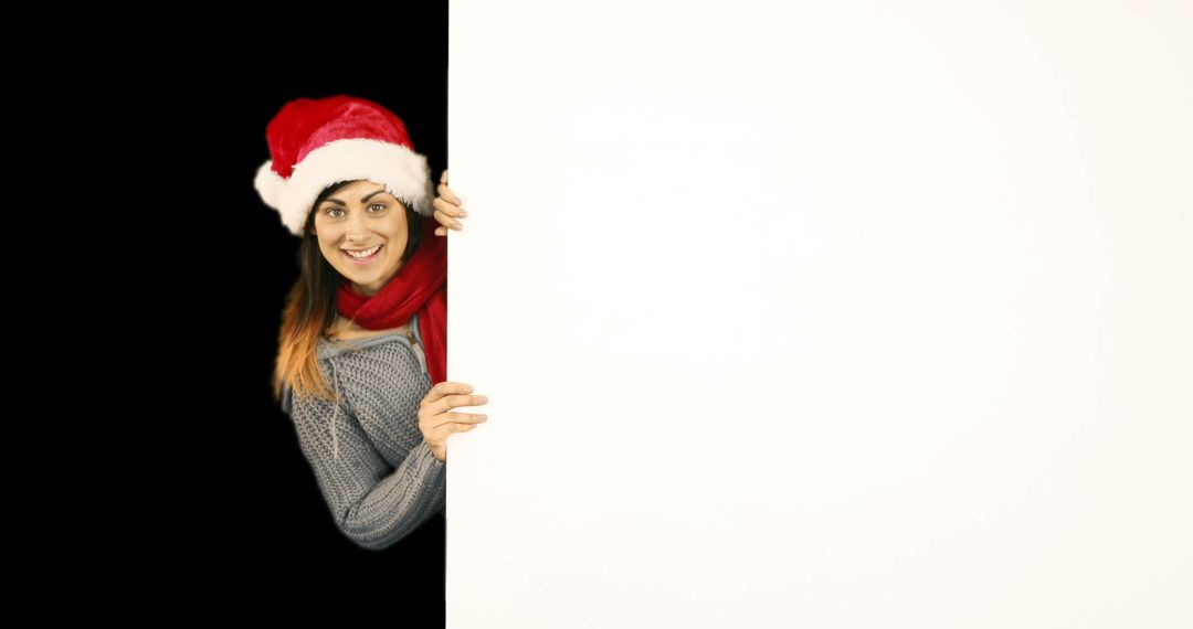 Woman in Santa Hat Holding Blank White Board - Free Images, Stock Photos and Pictures on Pikwizard.com