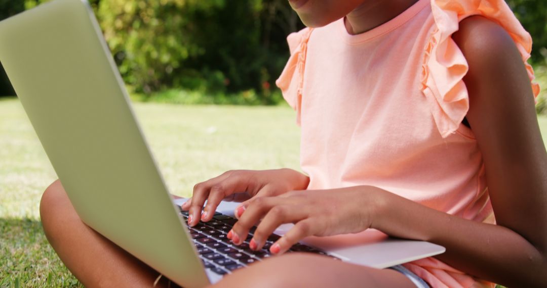 Young girl using laptop outdoors, learning and relaxation - Free Images, Stock Photos and Pictures on Pikwizard.com