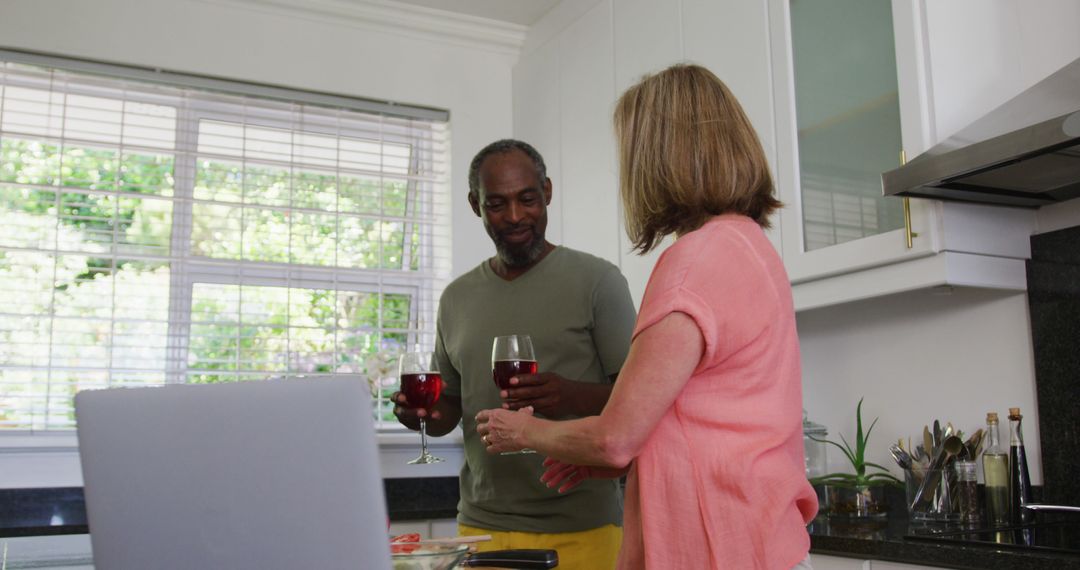 Happy Couple Enjoying Wine in Modern Home Kitchen - Free Images, Stock Photos and Pictures on Pikwizard.com