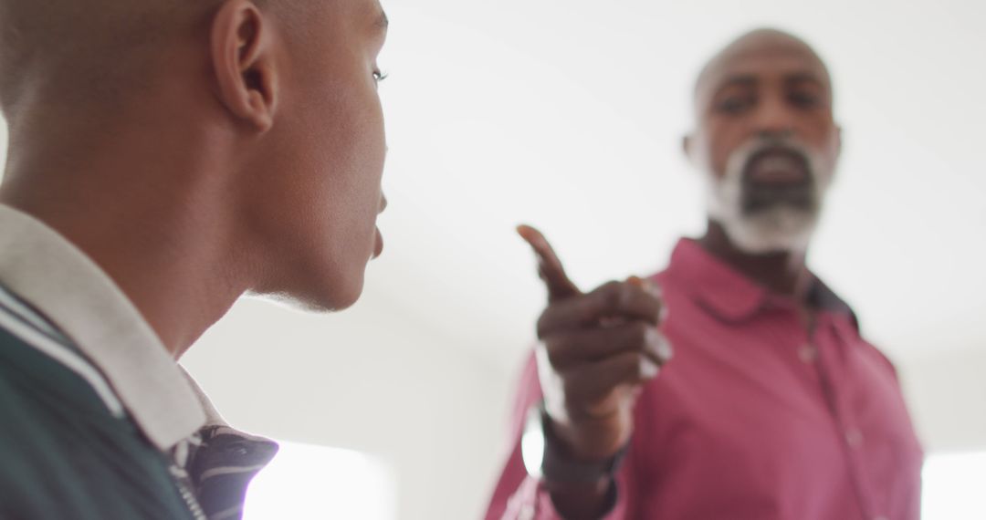 Father and Son Having Serious Discussion at Home