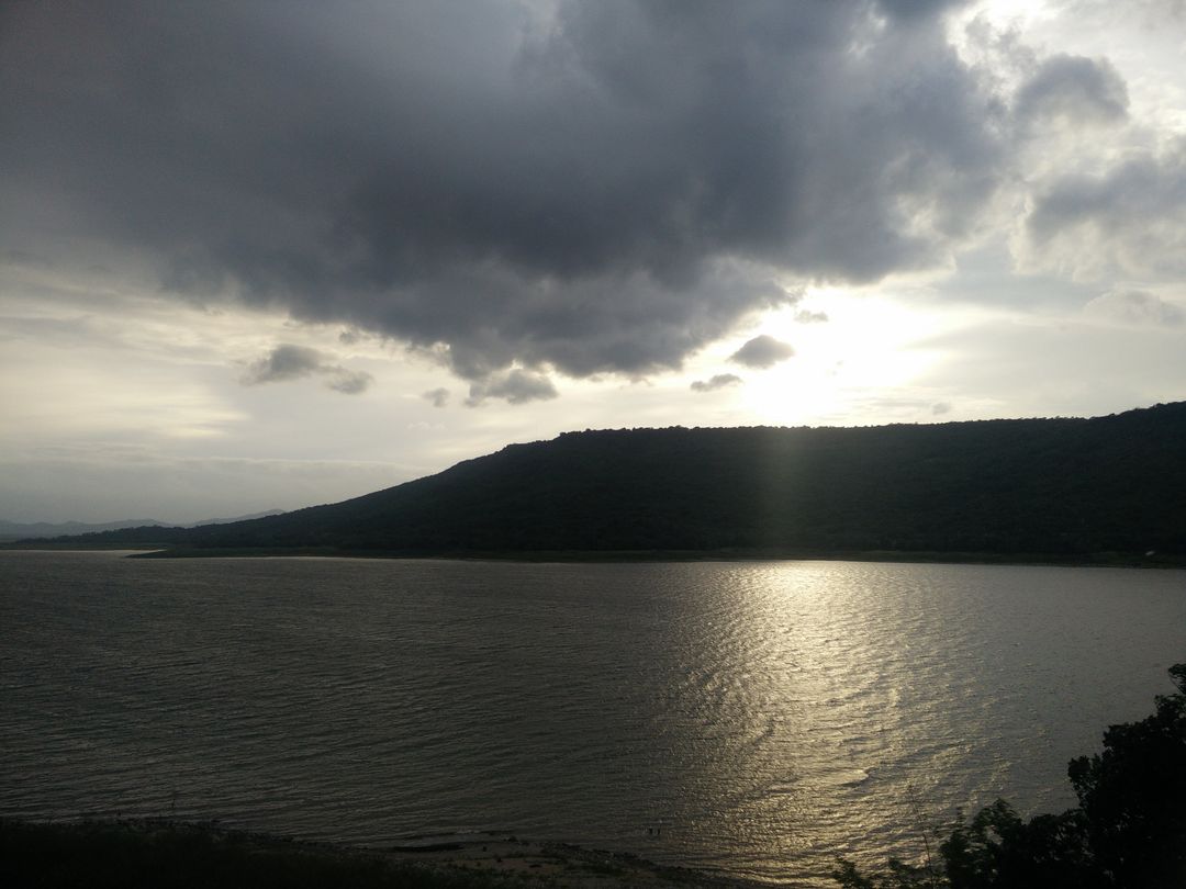 Scenic View of Cloudy Sky Over Mountainous Lake - Free Images, Stock Photos and Pictures on Pikwizard.com