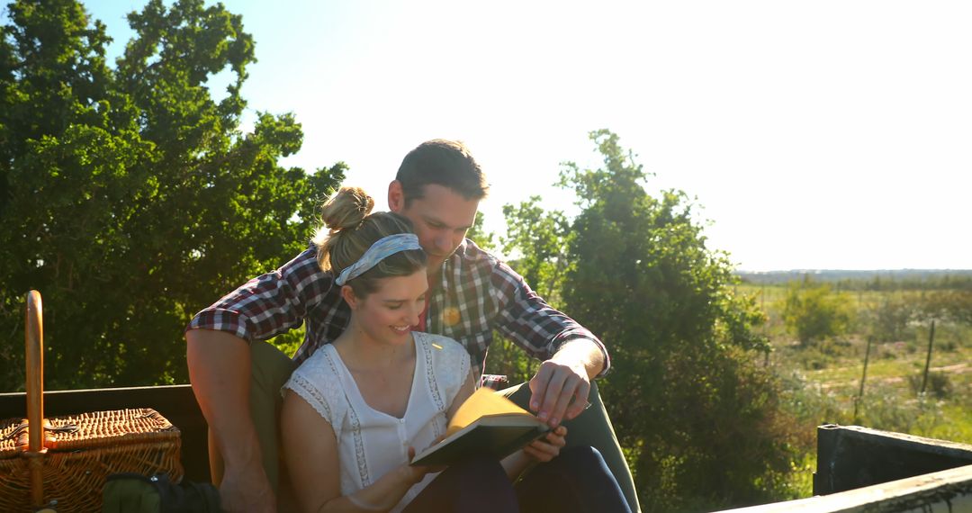 Couple Relaxing and Reading Book Outdoors in Nature - Free Images, Stock Photos and Pictures on Pikwizard.com