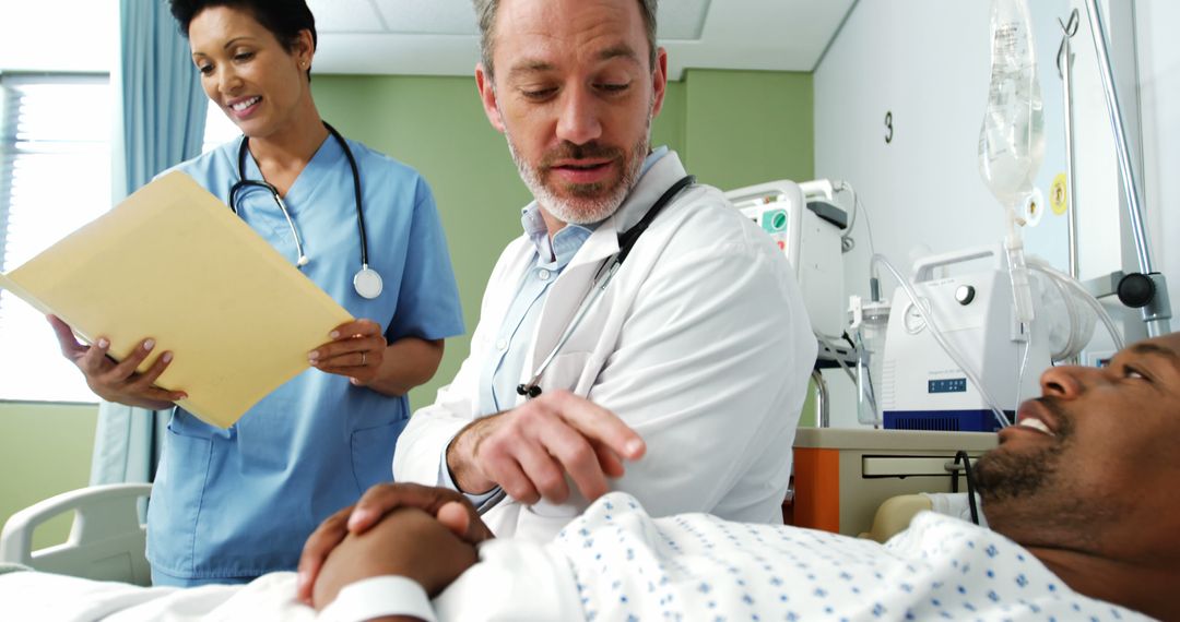 Medical Team Comforting Patient in Hospital Room - Free Images, Stock Photos and Pictures on Pikwizard.com