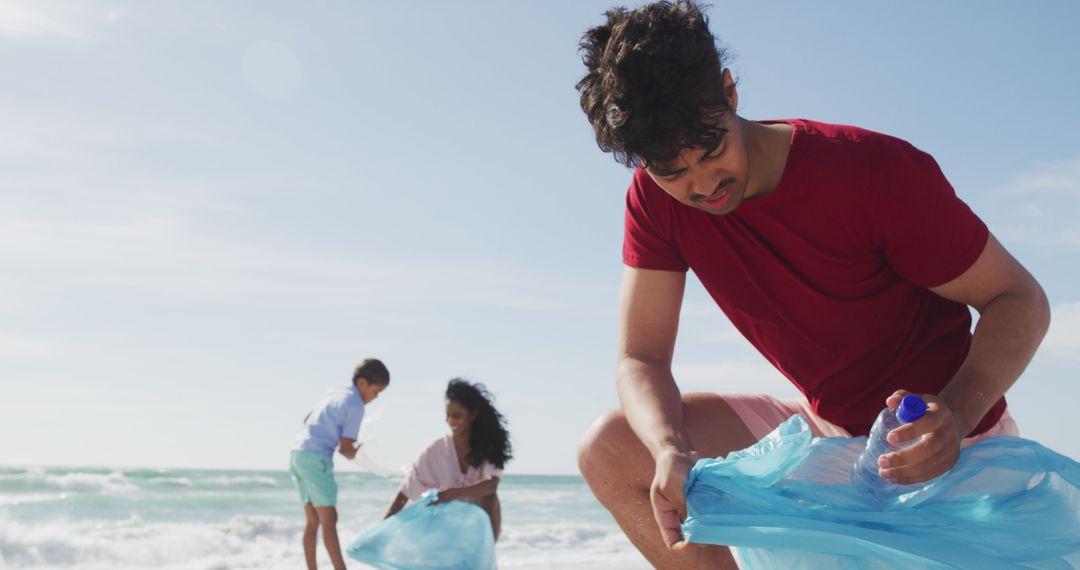 Family Collecting Trash on Beach Supporting Environmental Conservation