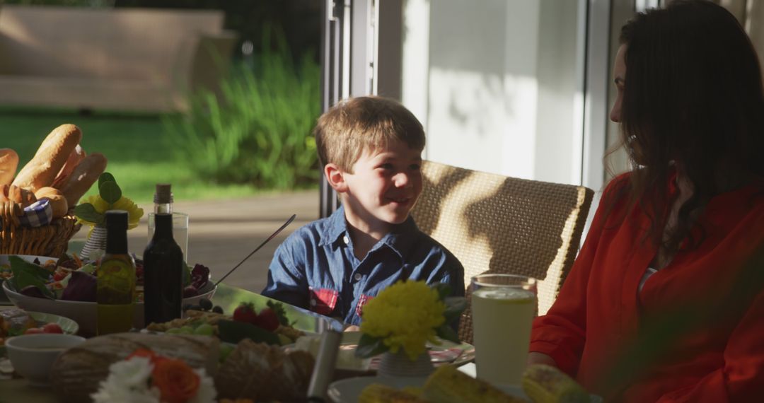 Mother and Son Enjoying Casual Outdoor Meal Together - Free Images, Stock Photos and Pictures on Pikwizard.com