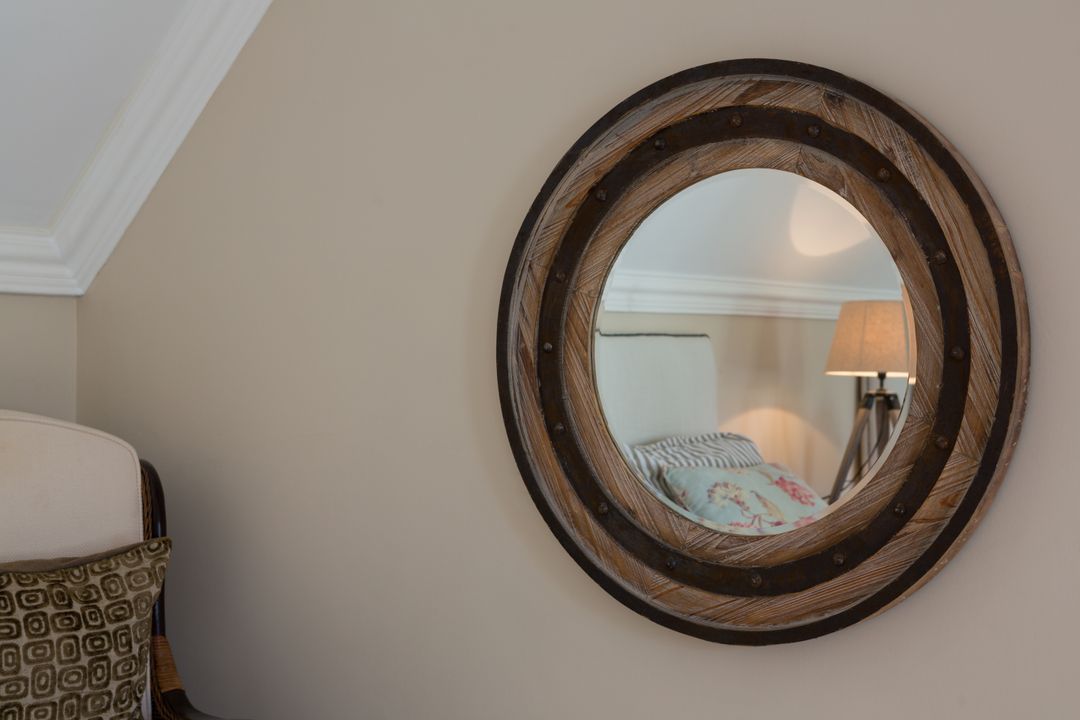 Wooden Framed Mirror on Beige Wall in Cozy Home Interior - Free Images, Stock Photos and Pictures on Pikwizard.com