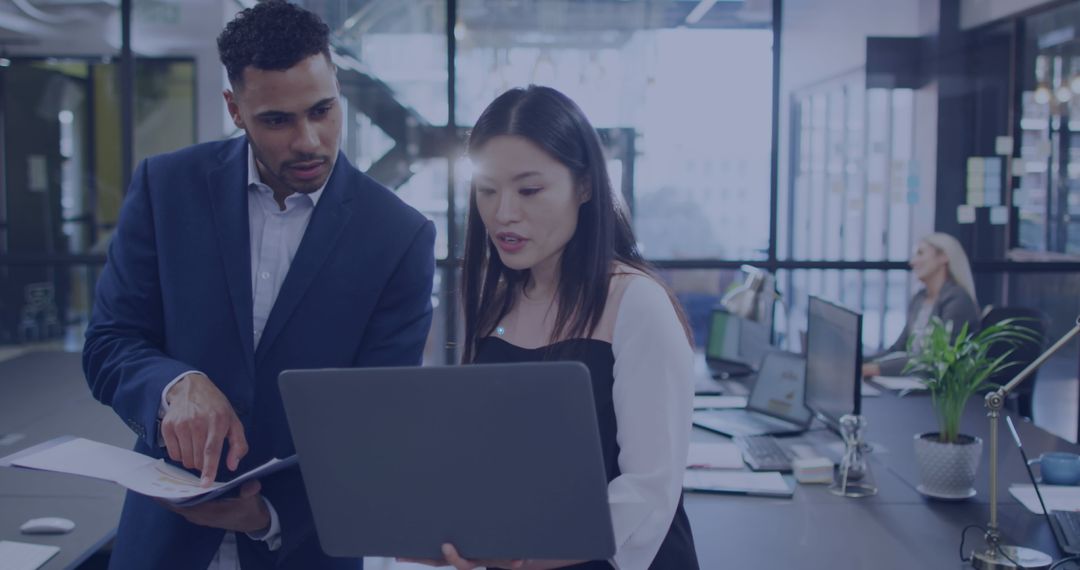 Focused Colleagues Collaborating in Modern Office