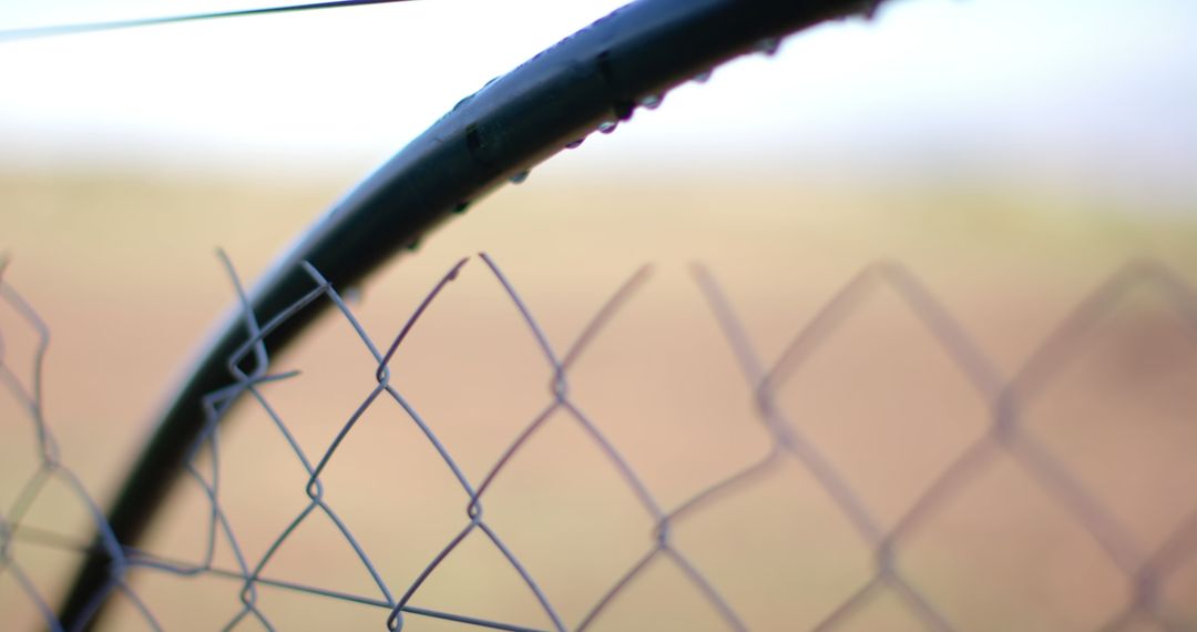 Selective Focus on Chain Link Fence with Water Droplets - Free Images, Stock Photos and Pictures on Pikwizard.com