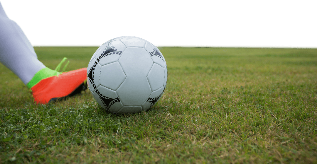 Soccer Player Kicking Ball on Green Field with Transparent Background