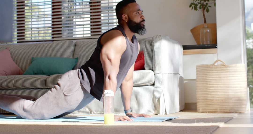 Focused Man Practicing Yoga at Home - Free Images, Stock Photos and Pictures on Pikwizard.com