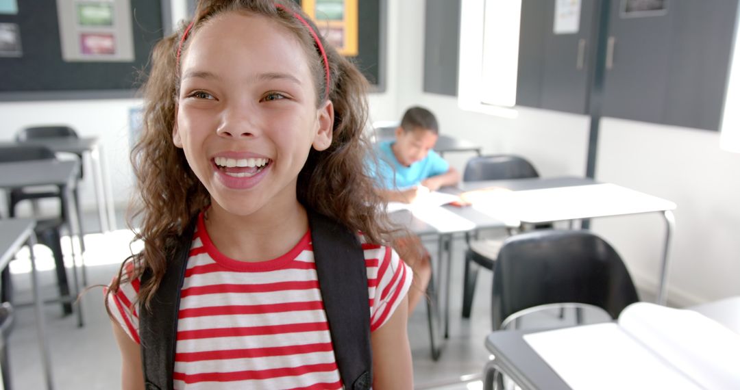 Joyful Student with Backpack in Classroom